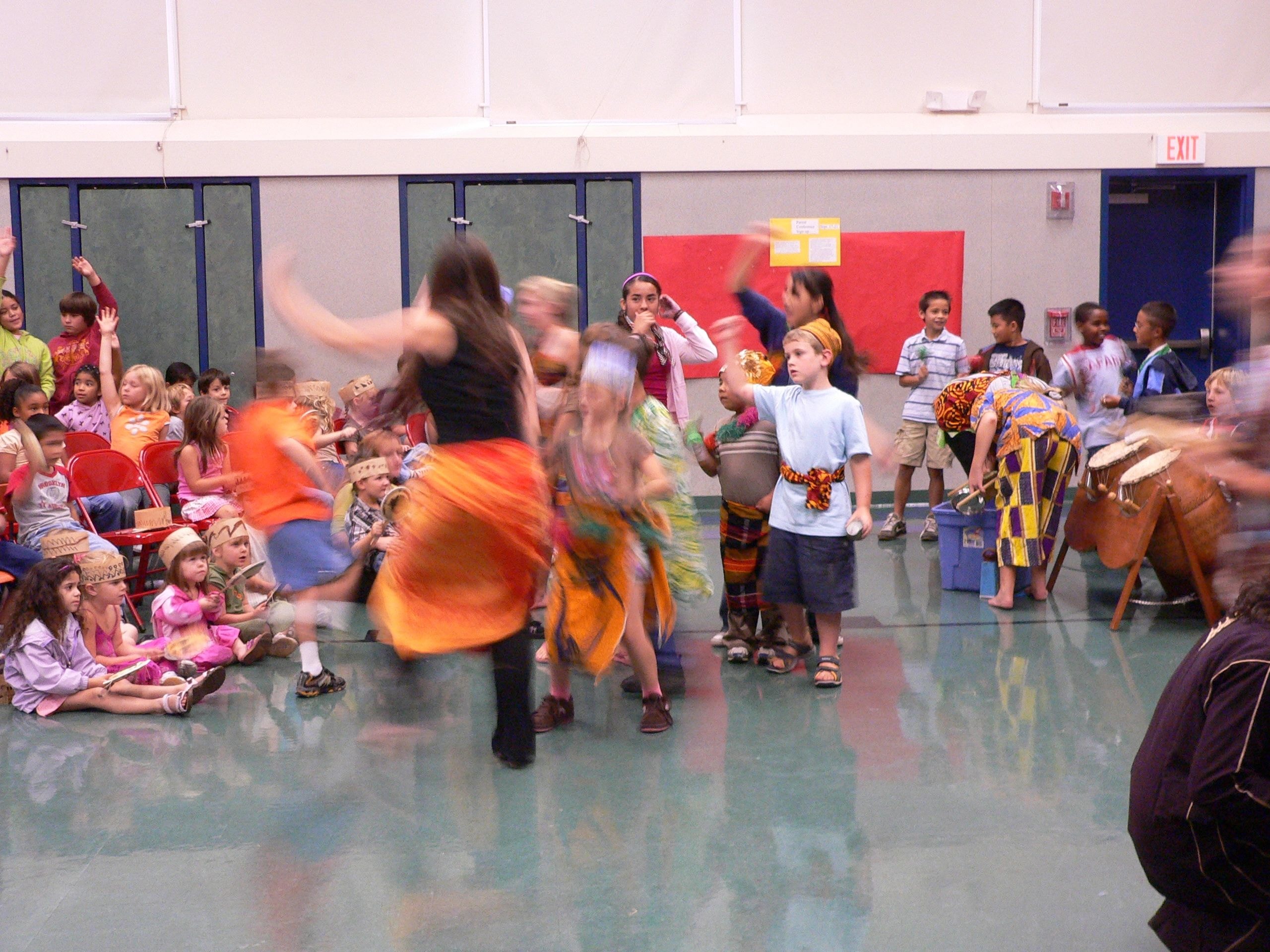 Students drumming together